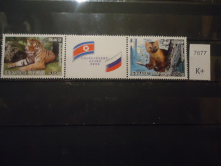 Фото марки Северная Корея 2005г с купоном **